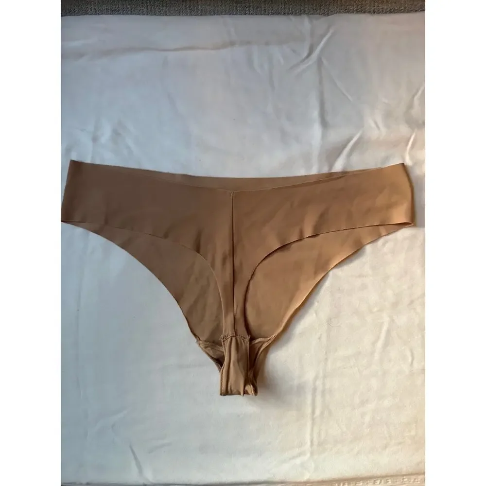 NWOT Calvin Klein Size M Seamless Thong Nude Tan Laser Cut Invisible No Show